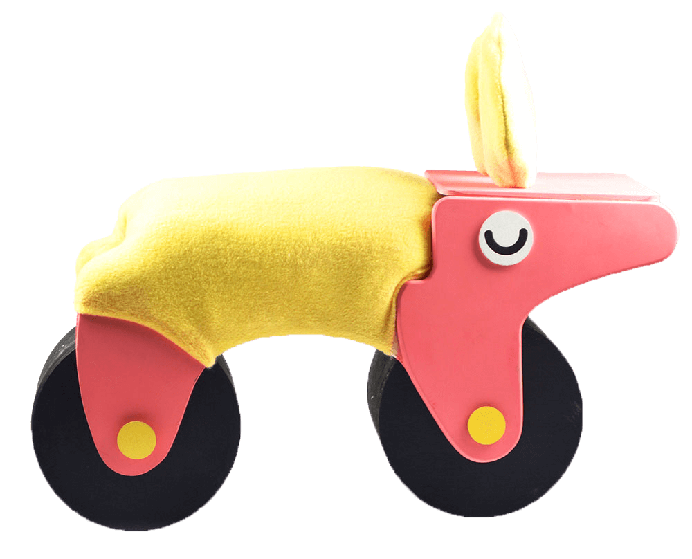Cat Hong's ride-on toy Manny, which is pink with closed eyes and a yellow upholstered back.